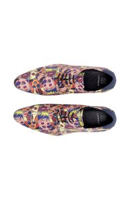 Colorful patterned shoes featuring graphics of faces in various expressions. Smooth surface, rounded toe, and black laces.