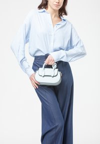 Miriade Borsa a mano - turchese