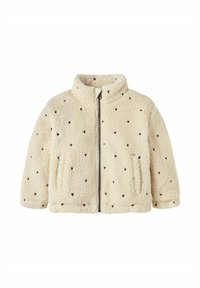 Veste en polaire couleur crème avec fermeture éclair à l'avant, col haut et motifs de cœurs noirs. Elle est dotée de deux poches latérales et d'une texture douce.
