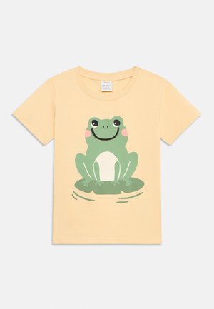 Laste hele kollase lühikese varrukaga T-särk, mille esiküljel on trükitud naeratav roheline kärnkonn lootoselehel istumas.