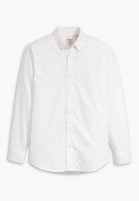 Bílá košile s dlouhým rukávem, knoflíková léga, vyztužený límec a diskrétní výšivka značky na hrudi.