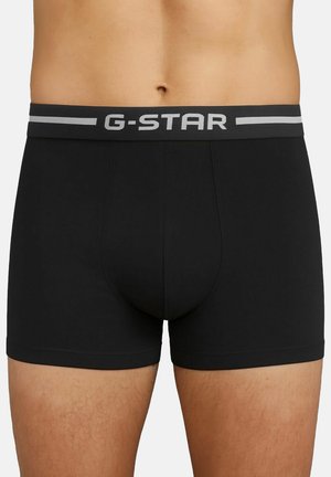 Schwarze Boxershorts mit grauem elastischem Bund und "G-STAR"-Logo. Hergestellt aus glattem Stoff mit passgenauer Form und flachen Nähten.