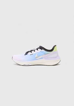 Light blue athletic shoe with a gradient effect, black laces, silver swoosh logo, pale purple accents, and a textured mesh upper.