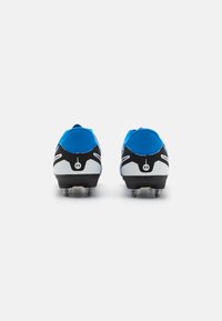 Blue synthetic football cleats with a black and white sole. Features include a textured upper and metal studs for traction.