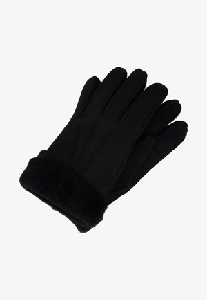 Gants noirs en matériau doux avec un poignet en fausse fourrure. Présentent des coutures sur le dessus et un design à cinq doigts pour chaleur et confort.