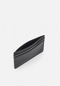 Black leather cardholder with a slim design, featuring multiple card slots and a textured surface. Accented with subtle stitching details.