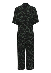Combinaison noire avec un motif floral vert feuillage, manches courtes, taille élastique et coupe à jambes larges. Tissu lisse avec une légère brillance.
