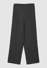 Pantaloni della tuta neri a gamba larga con vita elastica e texture liscia. Design semplice, senza hardware o motivi visibili.