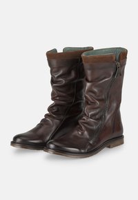 Brown leather knee-high boots with a slouched design, side zipper, and a soft suede trim at the top. Features a textured sole.