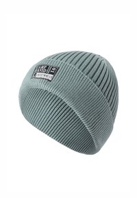 Knitted beanie in soft green with ribbed texture, featuring a branded patch on the front. Seamless design for comfort and warmth.