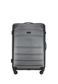 Hard-shell suitcase in dark gray with textured surface, horizontal lines, a top handle, and four wheels for mobility. Brand logo visible.