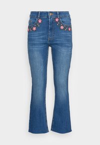 Urtåliga blå denimjeans med blommönsterbroderi på fickorna, femfickorsdesign, knappstängning och lätt blekning på tyget.