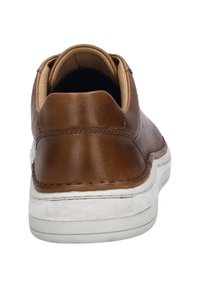Brown leather sneaker with a white rubber sole, featuring a smooth finish, rounded shape, and a cushioned interior for comfort.