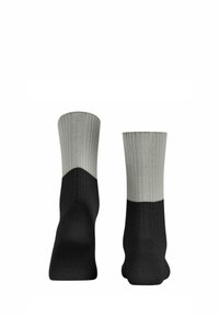 Schwarze und graue Socken mit gerippter Textur, die eine schwarze Grundfarbe und einen grauen oberen Abschnitt aufweisen, der in der Mitte deutlich übergeht.