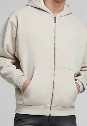 Vetoketjullinen college - beige