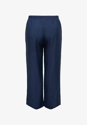 Granatowe, luźne spodnie z elastycznym paskiem w talii, wykonane z tkaniny o fakturze, z szerokimi nogawkami, pokazane od tyłu na białym tle.