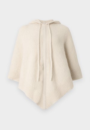 Kremfarvet poncho med hætte, lavet af blødt stof. Har ribbede kanter og en frontåbning med snore.