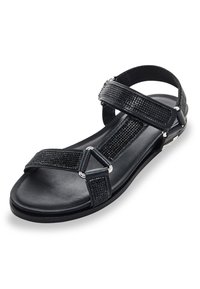 Zwarte sandalen met gestructureerde banden, kruislings ontwerp en metalen accenten. Platte zool met een gladde afwerking voor comfort.