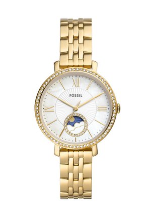Montre Fossil avec un bracelet en métal doré, un cadran rond en nacre blanche, des accents en cristal et un indicateur de phase lunaire en bas.