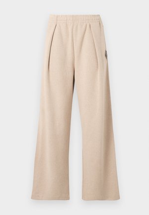 Bézs színű, széles szárú nadrág texturált anyagból, elülső redőkkel és elasztikus derékpánttal. Finom logó részlettel díszítve.