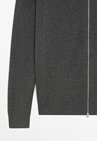 Dark gray knit sweater with long sleeves and a silver front zipper, shown from waist to sleeve on a white background.