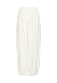 Pantalon blanc ample avec taille élastique et poignets froncés aux chevilles, en tissu léger.