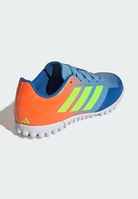 Sport shoes with a blue, orange, and green gradient design. Features mesh material, rubber sole, and three distinctive green stripes.