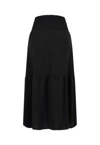 Jupe noire longueur genou avec une large ceinture élastique froncée et une partie basse ample, légèrement évasée, présentée sur un fond uni.
