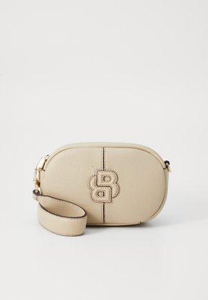 Beige textured leather bag with a rounded shape, featuring a gold clasp, a matching strap, and a prominent embossed logo on the front.