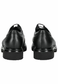 Schwarze Leder-Dressschuhe mit glattem Obermaterial, verstärkten Nähten und Gummisohlen mit einem leichten Absatz. Sie präsentieren ein klassisches Design.