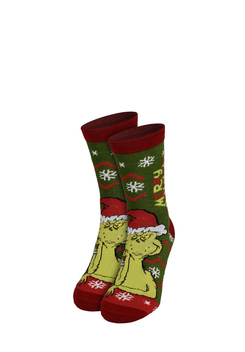Calze verdi lavorate a maglia con un personaggio che indossa un cappello rosso, con fiocchi di neve bianchi e il testo "MERRY" in giallo, rifiniture rosse sui polsini e sulla punta.