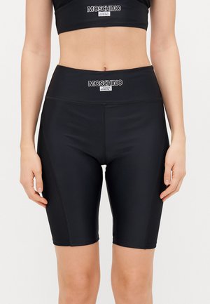 Schwarze Fahrradshorts aus glattem Stoff mit einem hohen Bund, ausgestattet mit Mesh-Akzenten an den Seiten und einem aufgedruckten Logo oben.