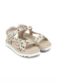 Beige kruisband sandalen met rhinestone accenten, met een textuur bovenwerk en een dikke witte zool voor demping en ondersteuning.