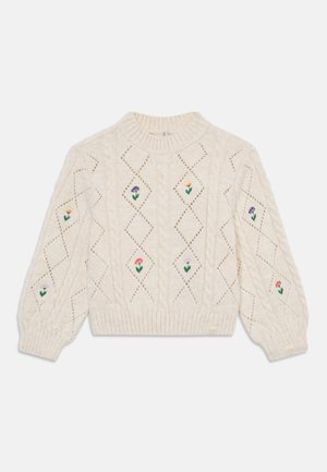 Pull en maille torsadée crème avec des motifs en losange, ornée de broderies florales colorées. Poignets et ourlet côtelés, design cropped.