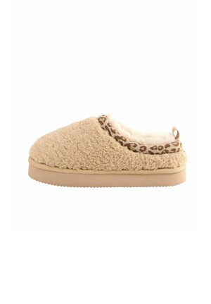 Beige Hausschuh mit einer strukturierten, flauschigen Außenseite. Verfügt über einen gepolsterten Kragen mit einer braunen gemusterten Borte und einem weichen Innenfutter. Flache Sohle.