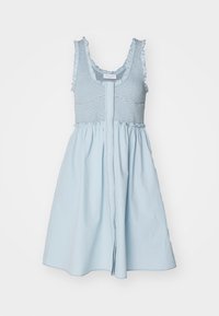 Light blue dress with a smocked bodice, ruffled straps, and a flared skirt. Fabric appears soft with a smooth texture. Central zipper closure visible.