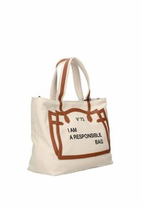 Sac en toile de couleur crème avec des bordures en simili cuir marron. Présente un texte imprimé "JE SUIS UN SAC RESPONSABLE" en noir, avec des poignées doubles.