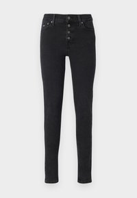 Fekete farmer skinny nadrág magas derékkal, öt gombos záródással és minimalista dizájnnal. Hátul zsebekkel és diszkrét varrási részletekkel rendelkezik.