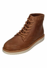Braune Leder-Ankle-Boots mit runder Zehenkappe, Schnürverschluss vorne und strukturiertem Obermaterial. Mit einer hellen Gummisohle und dezentem Branding.