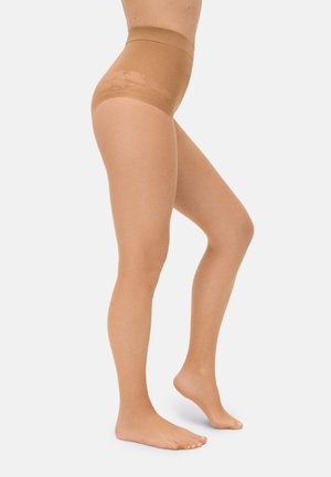 Vista lateral de piernas con pantimedias transparentes color nude, de cintura alta y con detalles de encaje en la pretina.