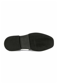 Suola di scarpa in gomma nera con un centro liscio e rilievi testurizzati ai bordi per una maggiore aderenza, caratterizzata da una forma arrotondata e design piatto.