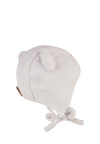 Soft white baby hat with ear flaps, small bear ears on top, and ties at the bottom for securing under the chin.
