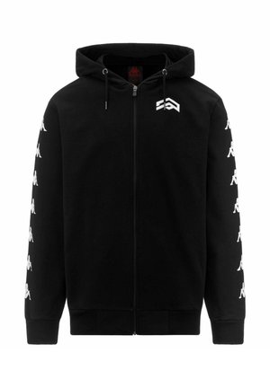 Sweat à capuche zippé noir avec des logos Kappa blancs courant le long des deux manches et un logo géométrique blanc sur le haut gauche de la poitrine.