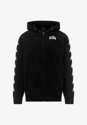 Sweat à capuche zippé noir avec des logos Kappa blancs courant le long des deux manches et un logo géométrique blanc sur le haut gauche de la poitrine.