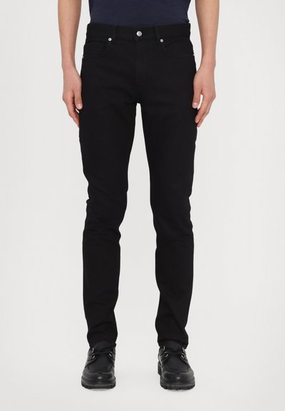 Black denim jeans with a slim fit, five-pocket design, and metal hardware detailing. Features a smooth texture and straight leg shape.