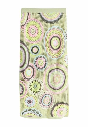 Knit green skirt with multicolored pastel circular crochet patterns and a ribbed waistband.