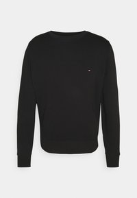 Felpa nera con maniche lunghe, girocollo e polsini a costine. Presenta un piccolo logo colorato sul petto. Materiale morbido e vestibilità regular.