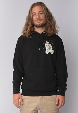 Black hoodie made of soft material featuring a front pocket and a design of hands in prayer with “FAITH” text and radiating lines.
