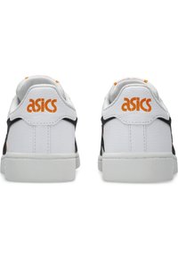 White ASICS sneakers with black accents and orange branding on the heel. Smooth leather material, low-top silhouette, padded collar.