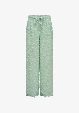 Pantalon large vert clair avec tissu texturé à franges et taille à cordon, présenté sur un fond blanc.